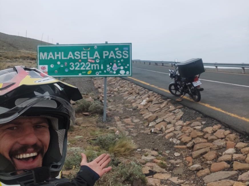 Alex at the Mahlasela Pass sign, 3222 metres, Lesotho